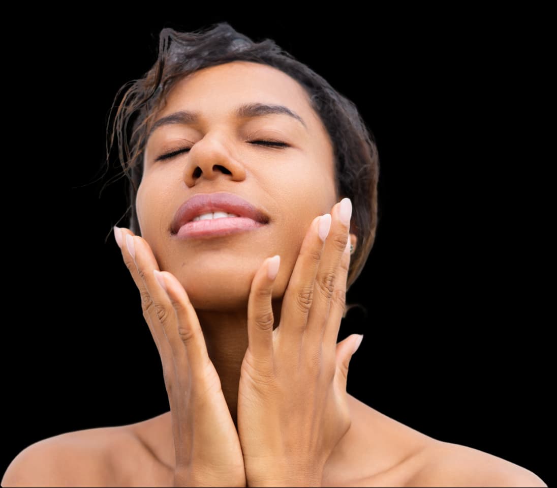 Woman with hands on neck looking up